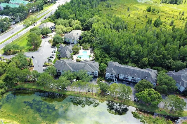 a room with kitchen island a refrigerator and a fireplace