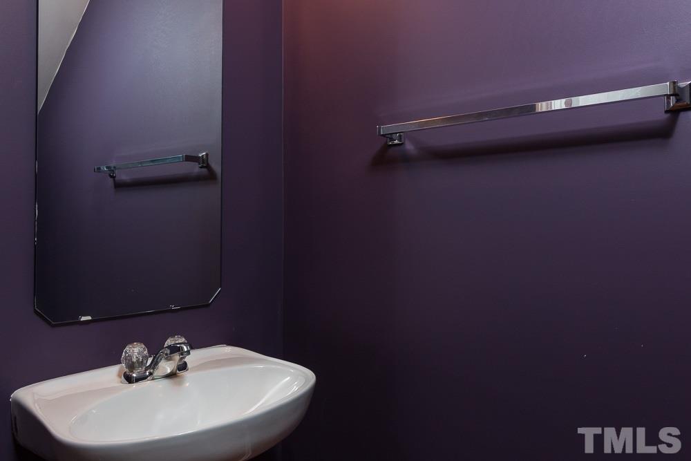 7839 Silverthread Lane Raleigh, NC 27617 - Photo 8 of 23 a bathroom with a sink and a mirror