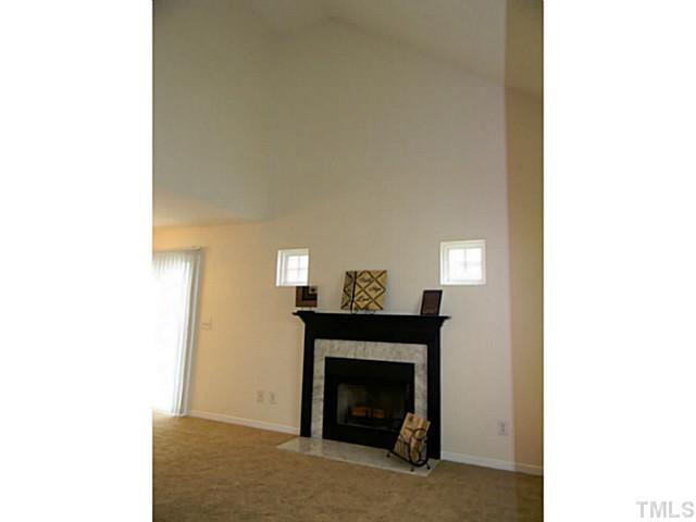 7217 Lowell Ridge Road Raleigh, NC 27616 - Photo 8 of 24 Vaulted ceilings in livingroom