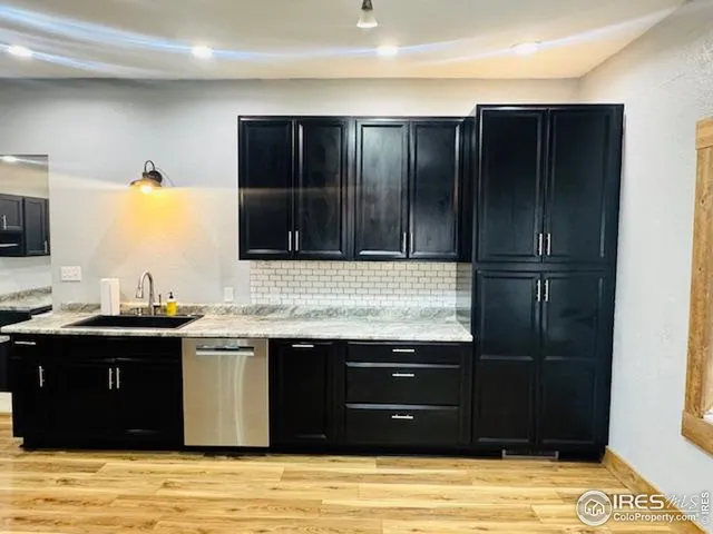 a kitchen with a sink and a stove