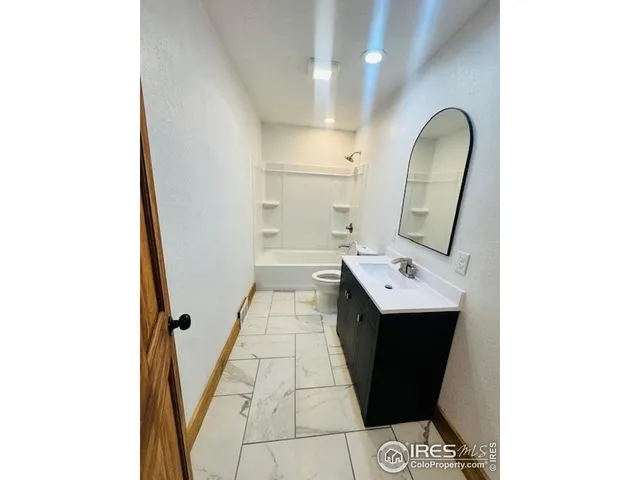 a bathroom with a sink and mirror