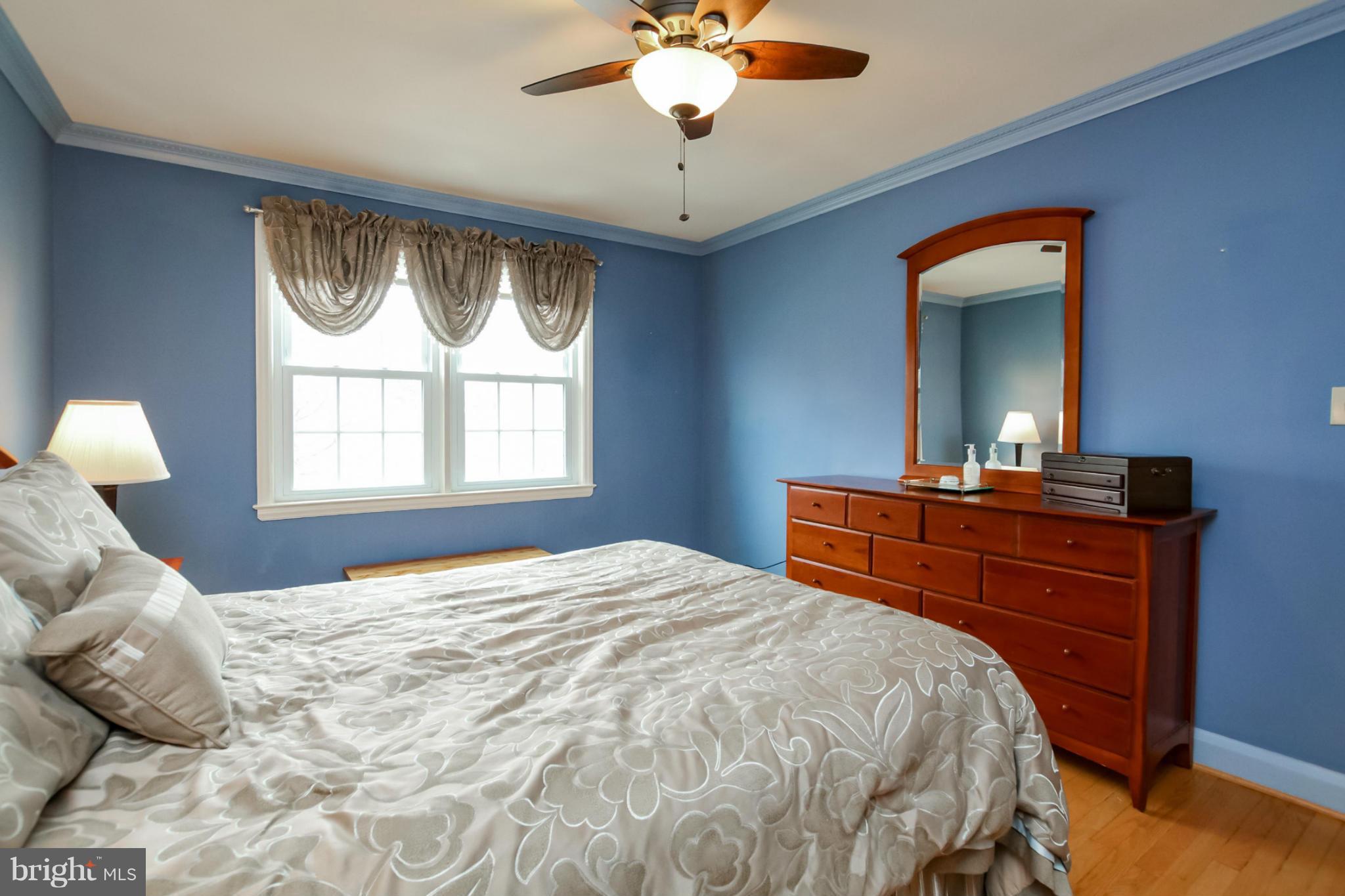 181 Dumbarton Road Baltimore, MD 21212 - Photo 18 of 30 a bedroom with a bed and a chandelier