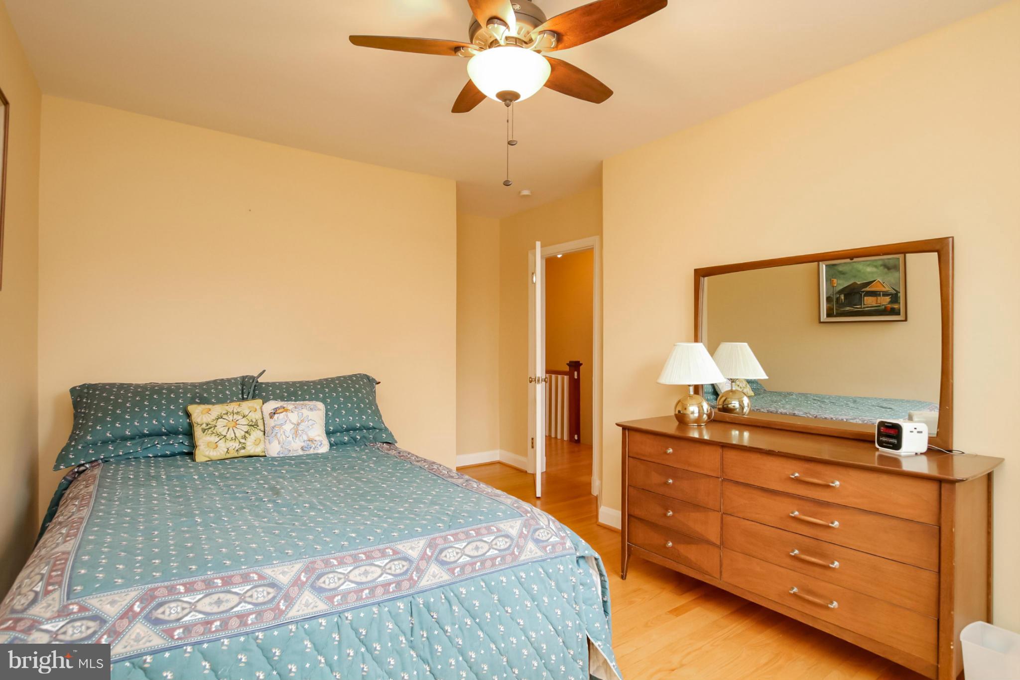 181 Dumbarton Road Baltimore, MD 21212 - Photo 20 of 30 a bedroom with a bed and a dresser