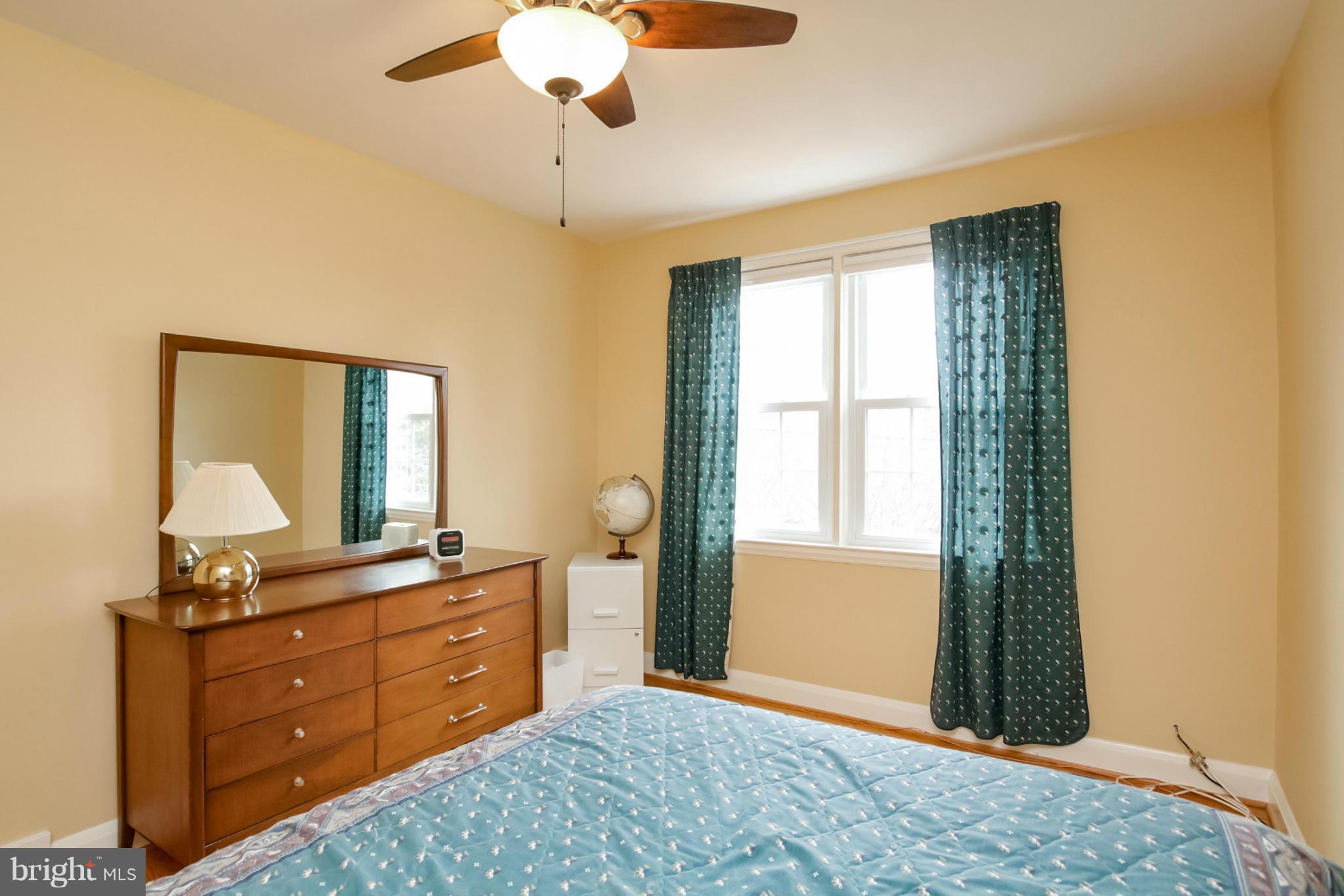 181 Dumbarton Road Baltimore, MD 21212 - Photo 21 of 30 a bedroom with a bed and a dresser