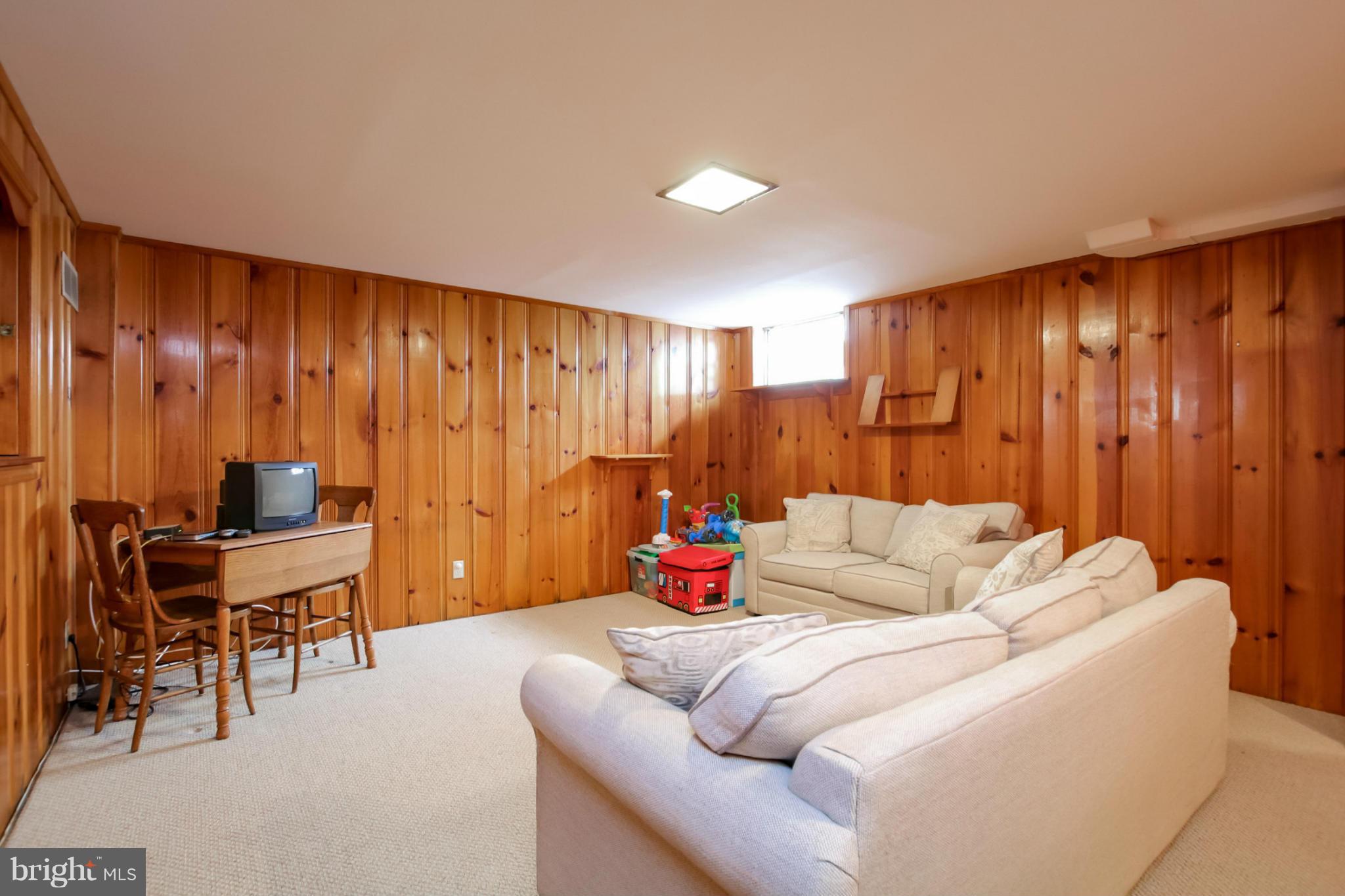 181 Dumbarton Road Baltimore, MD 21212 - Photo 24 of 30 a living room with furniture and a fireplace