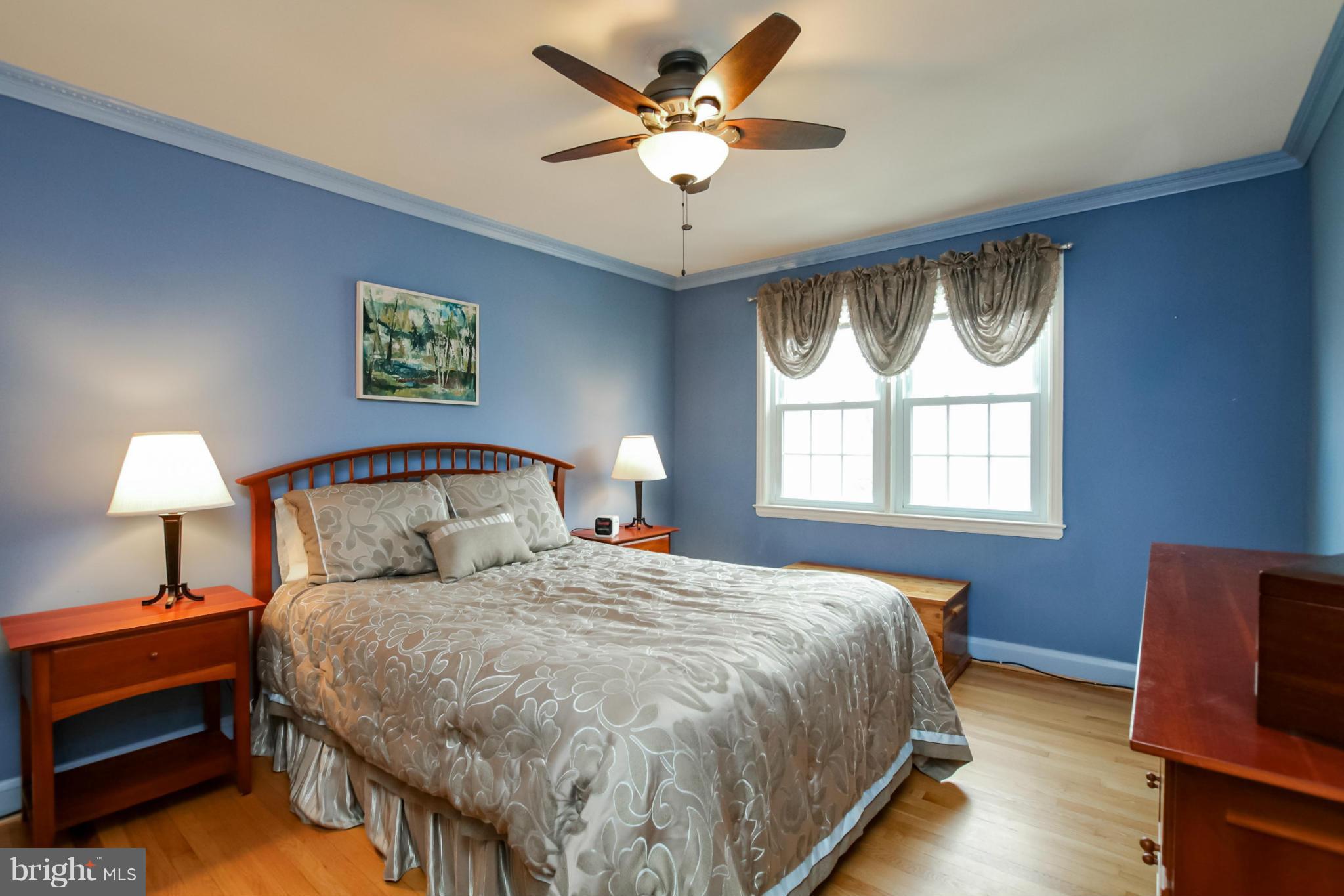 181 Dumbarton Road Baltimore, MD 21212 - Photo 7 of 30 a bedroom with a bed and a chandelier