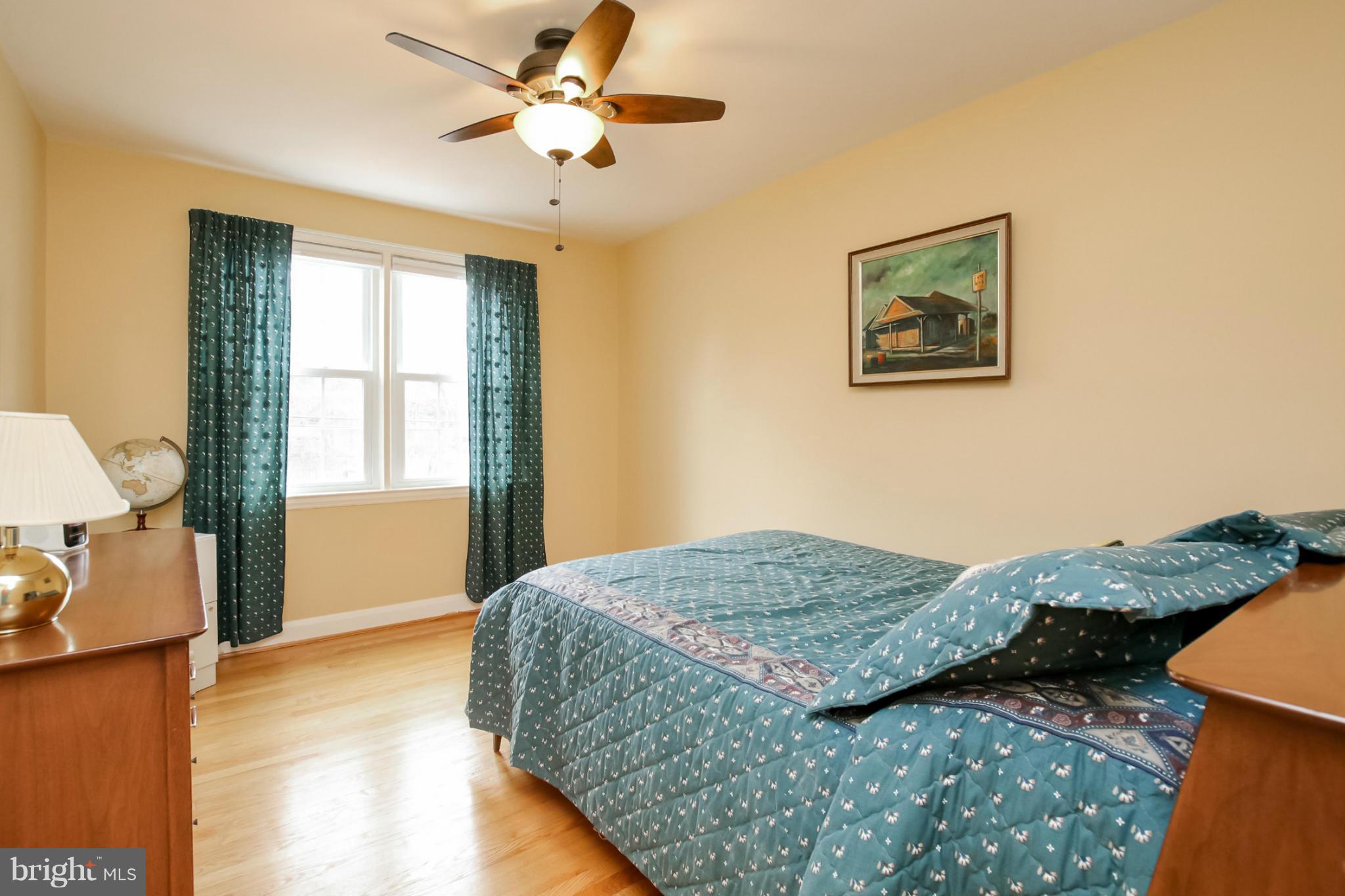 181 Dumbarton Road Baltimore, MD 21212 - Photo 8 of 30 a bedroom with a bed and a chandelier