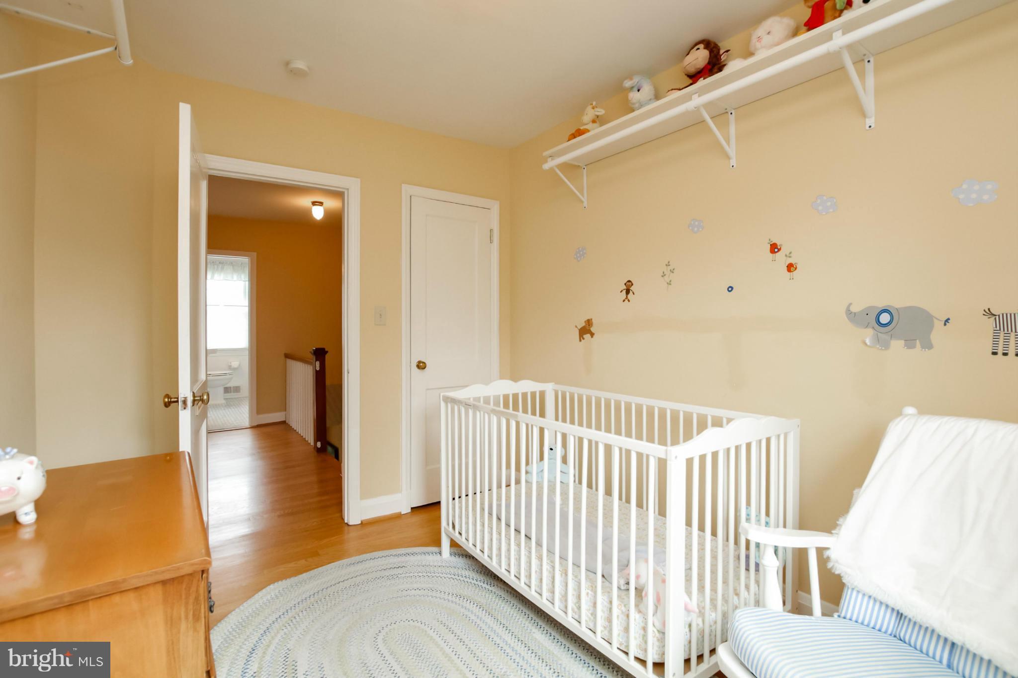 181 Dumbarton Road Baltimore, MD 21212 - Photo 9 of 30 a view of a bedroom with wooden floor