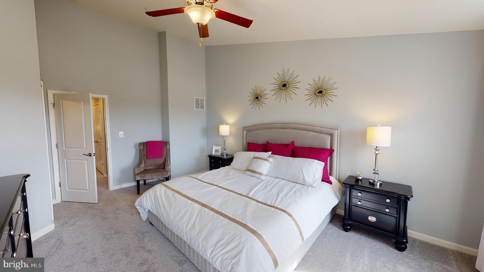 306 Purple Place Edgewood, MD 21040 - Photo 20 of 46 a bedroom with a bed and a chandelier