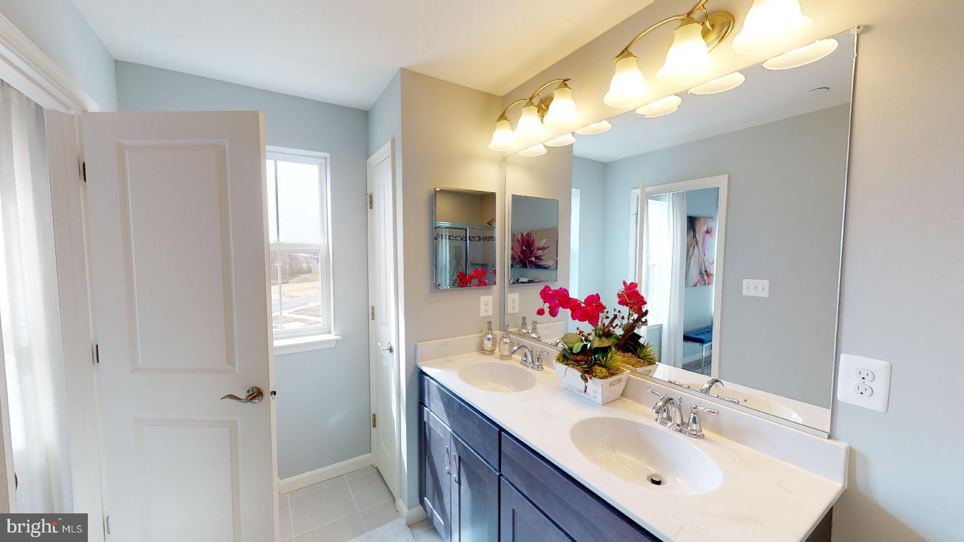 306 Purple Place Edgewood, MD 21040 - Photo 22 of 46 a bathroom with a sink vanity and a mirror