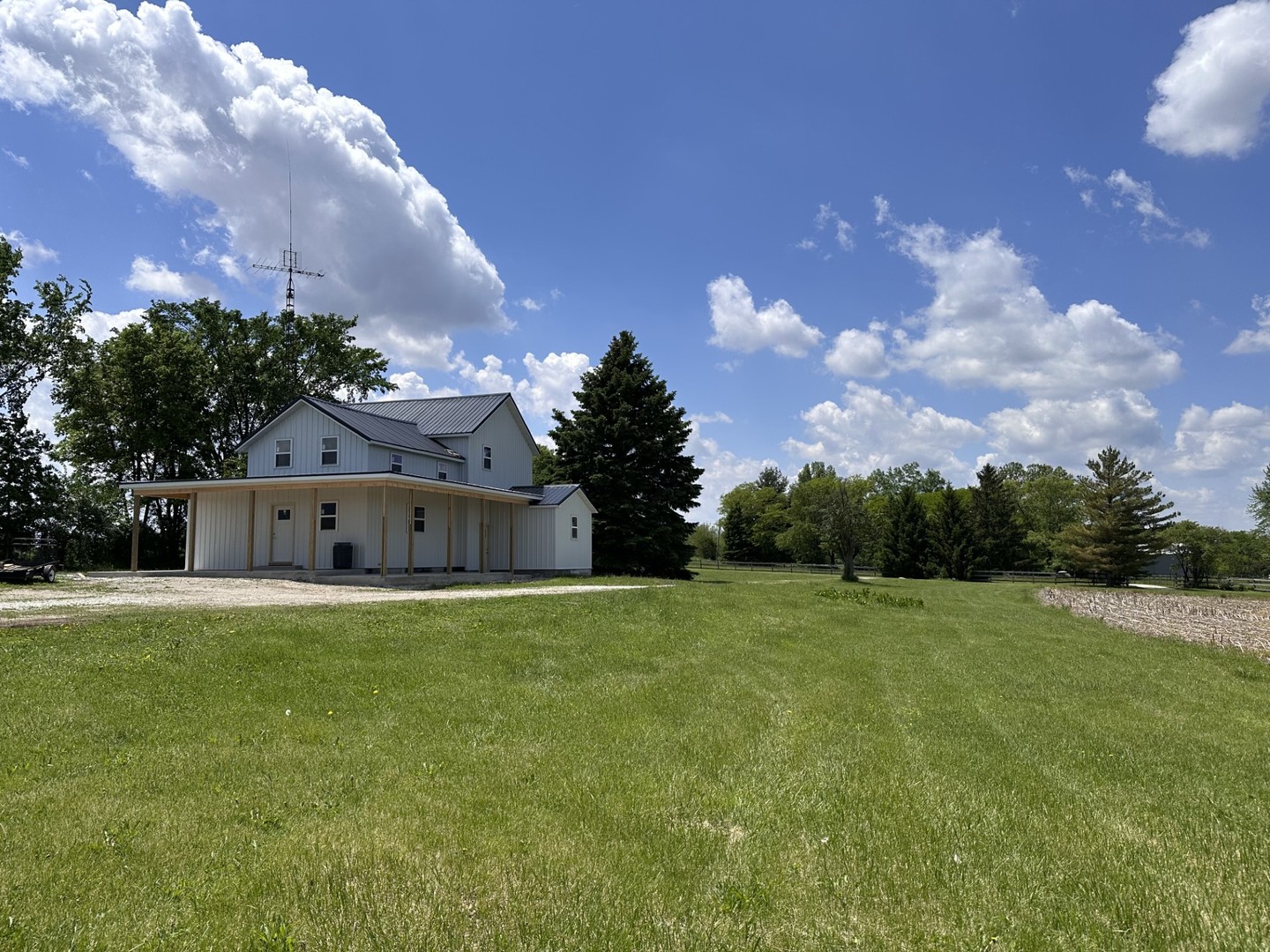 2452 East 350th Road Oglesby, IL 61348 - Photo 1 of 27 a front view of house with yard and trees in the background