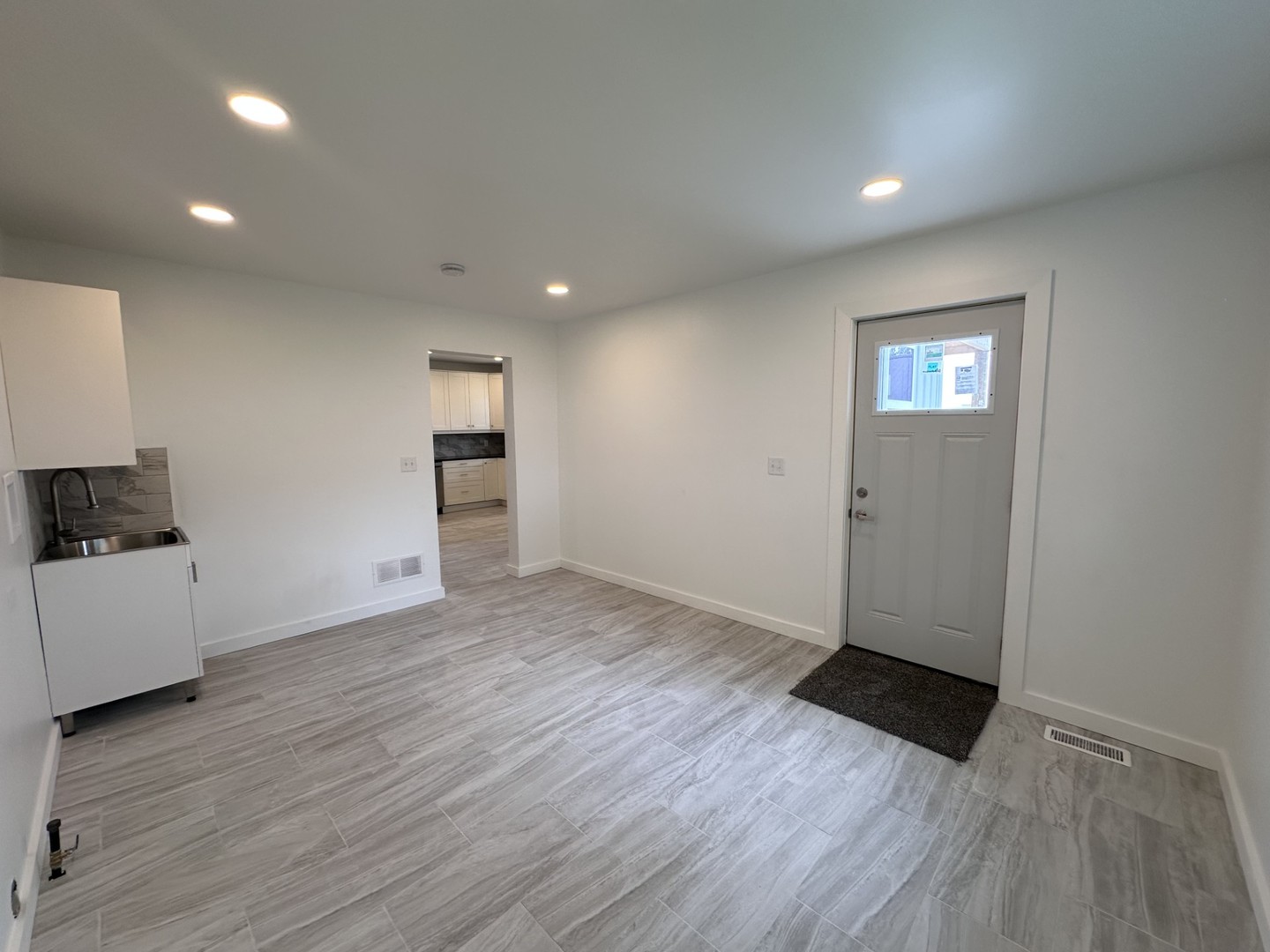 2452 East 350th Road Oglesby, IL 61348 - Photo 13 of 27 an empty room with wooden floor and windows