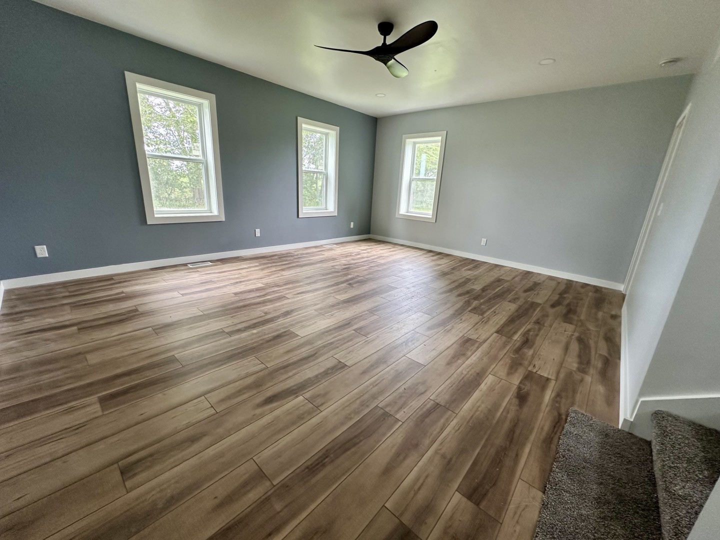 2452 East 350th Road Oglesby, IL 61348 - Photo 16 of 27 a view of an empty room with wooden floor and window