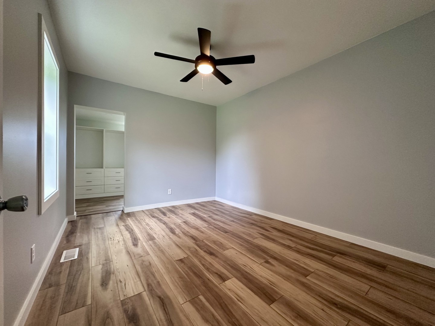 2452 East 350th Road Oglesby, IL 61348 - Photo 18 of 27 wooden floor in an empty room with a window
