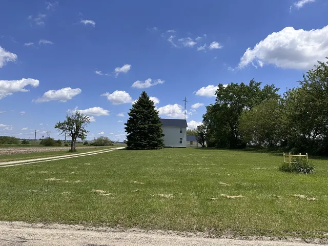 a large kitchen with stainless steel appliances granite countertop a stove a sink and a refrigerator