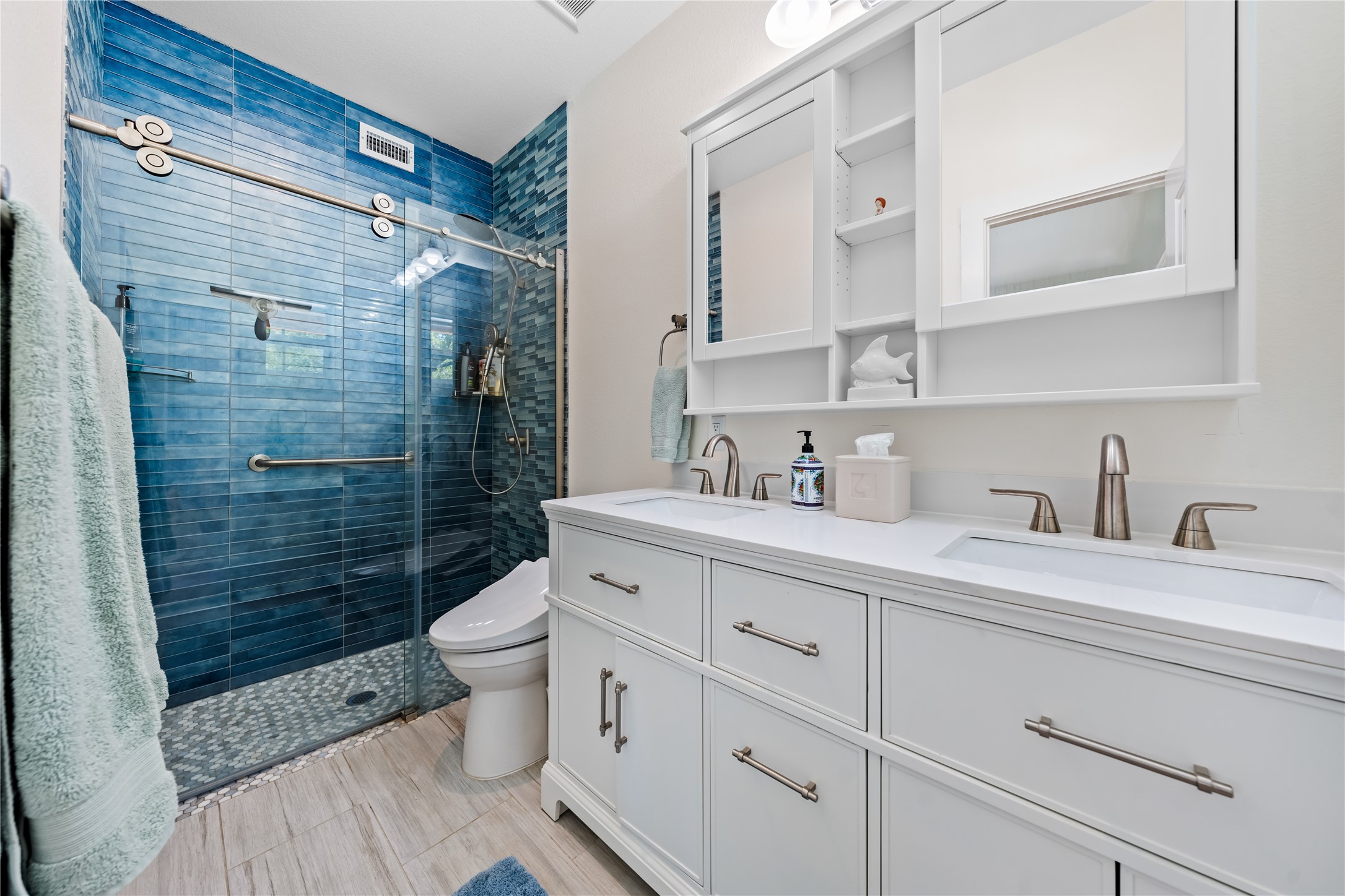 7670 Nez Perce Trace Manor, TX 78653 - Photo 27 of 40 Full bathroom with a shower stall, a sink, and toilet