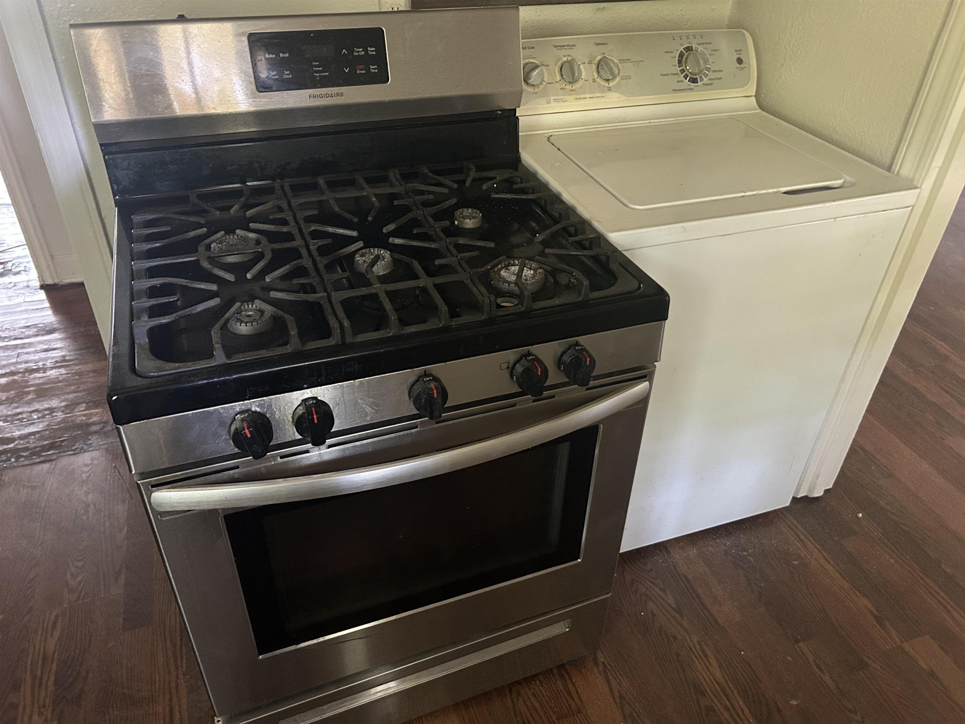 904 North Ball Road Memphis, TN 38106 - Photo 4 of 12 Stainless steel range with a gas cooktop, featuring a front control panel and integrated oven