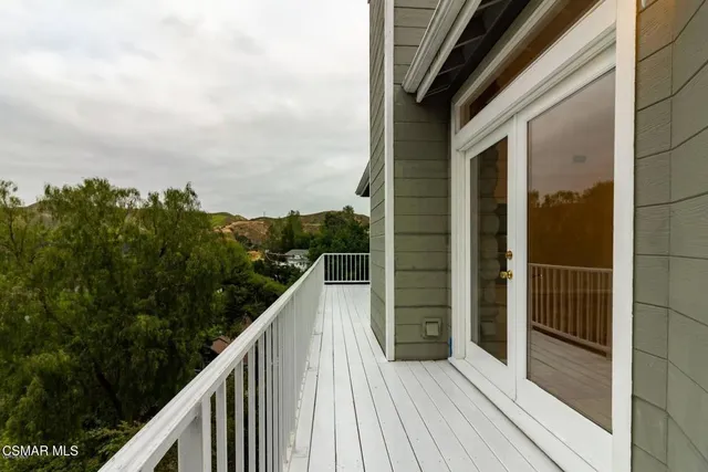 a view of balcony and yard