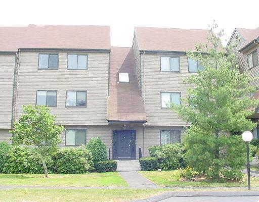 3 Seir Hill Road, Unit E2 Norwalk, CT 06850 - Photo 1 of 1 a front view of a house with a yard and garage