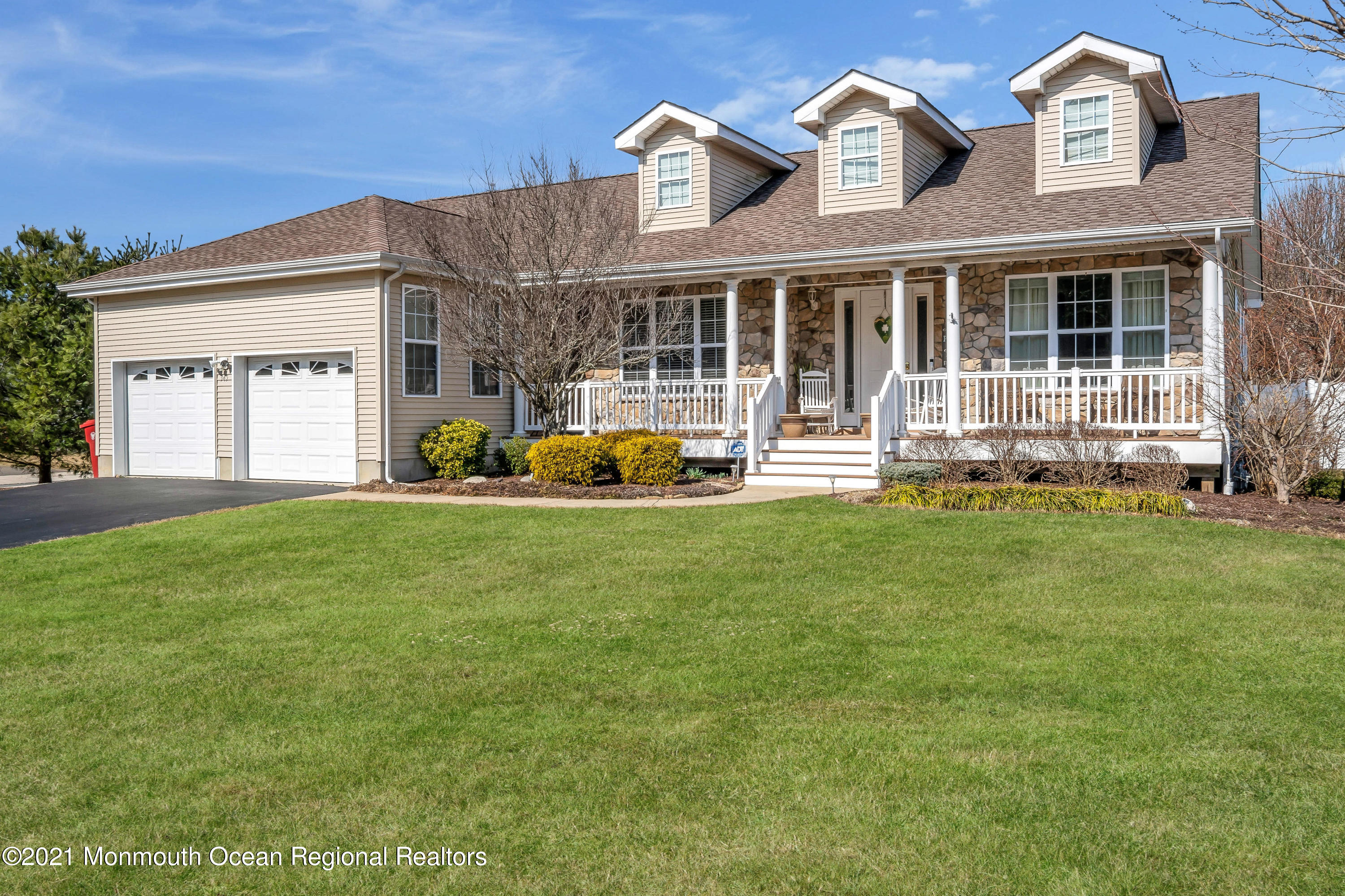 345 Columbus Circle Southeast Bayville, NJ 08721 - Photo 1 of 56 a front view of a house with a yard
