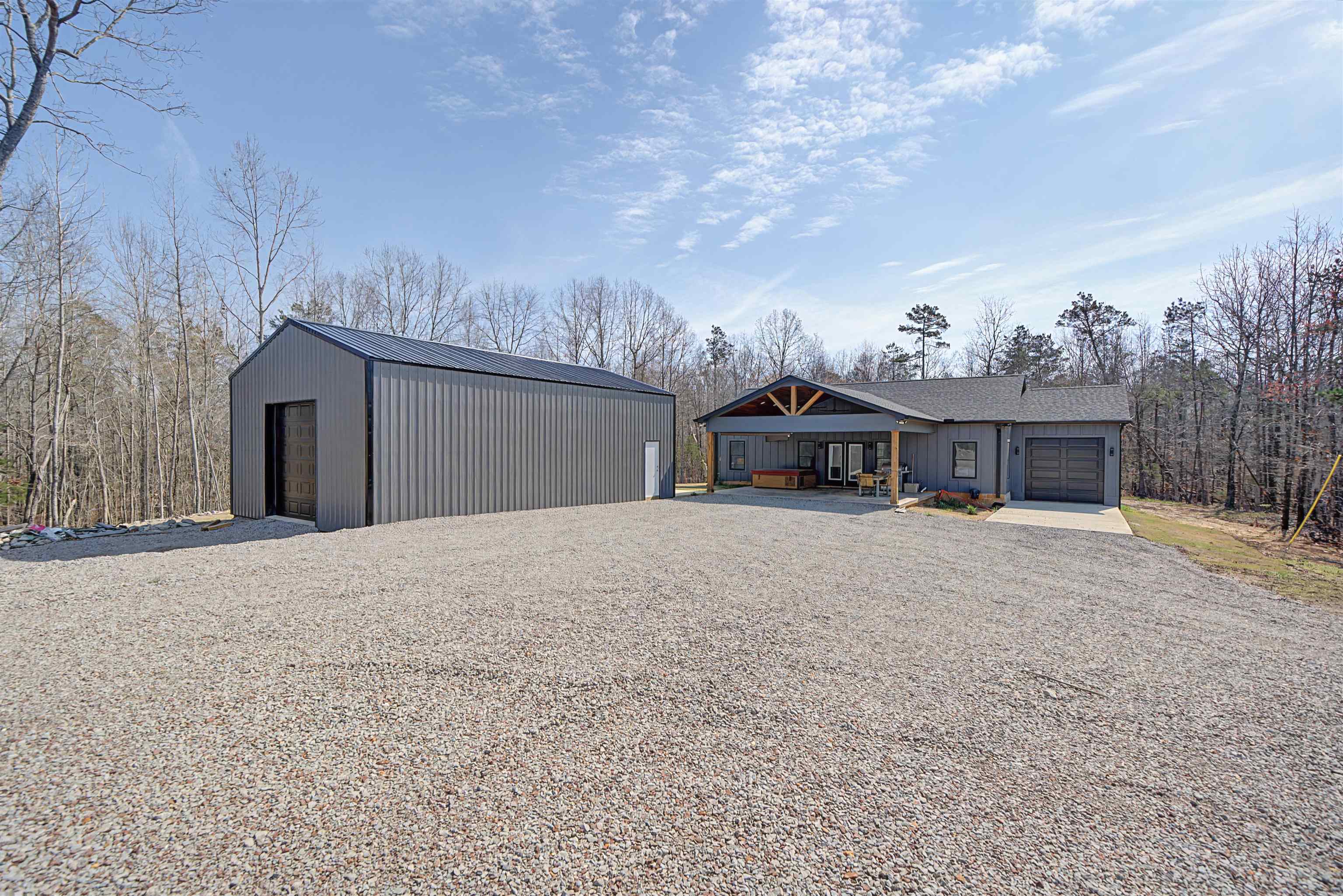 5439 Hines Gin Road Selmer, TN 38375 - Photo 1 of 33 a front view of a house with a yard and garage