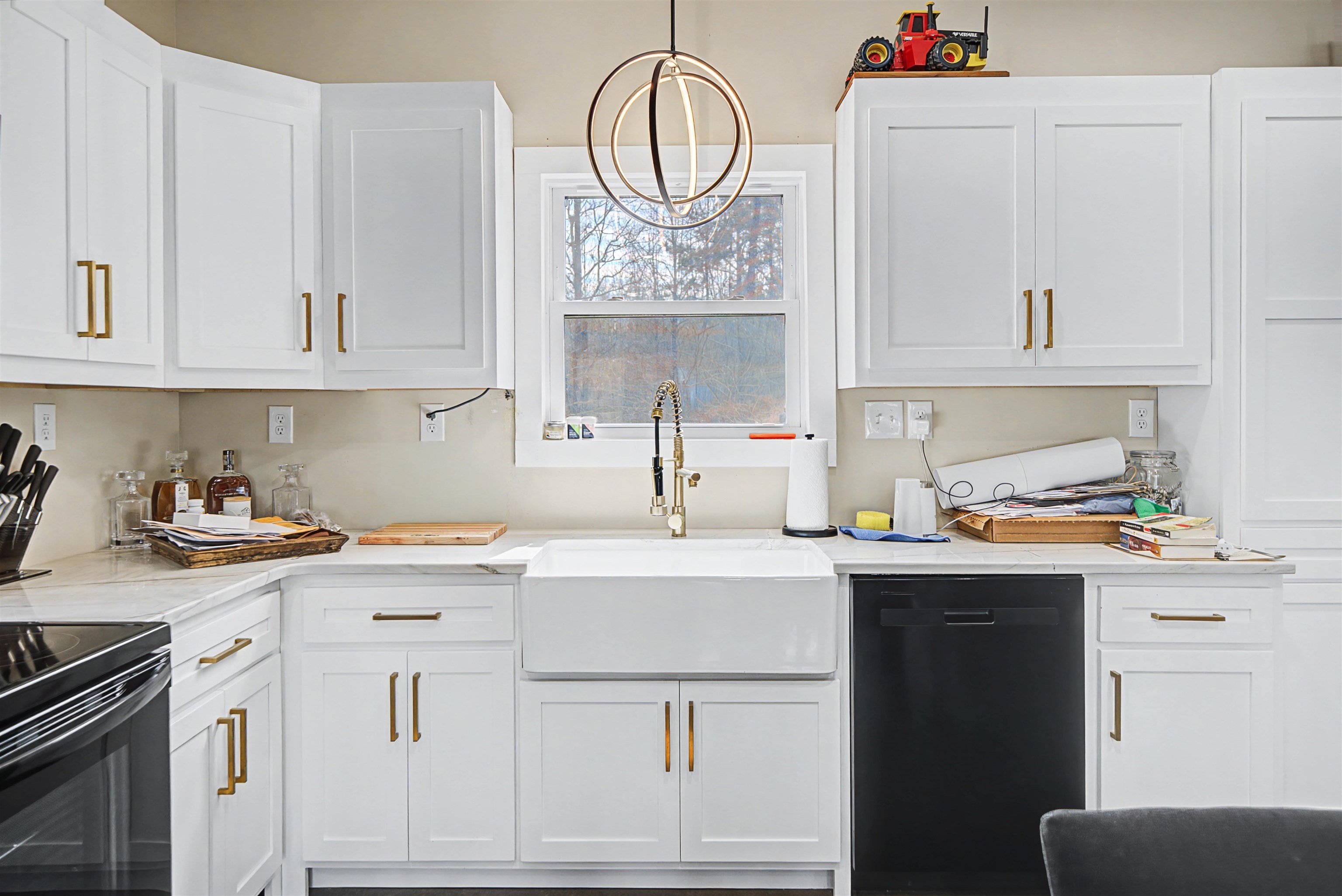 5439 Hines Gin Road Selmer, TN 38375 - Photo 12 of 33 a kitchen with granite countertop white cabinets and white appliances