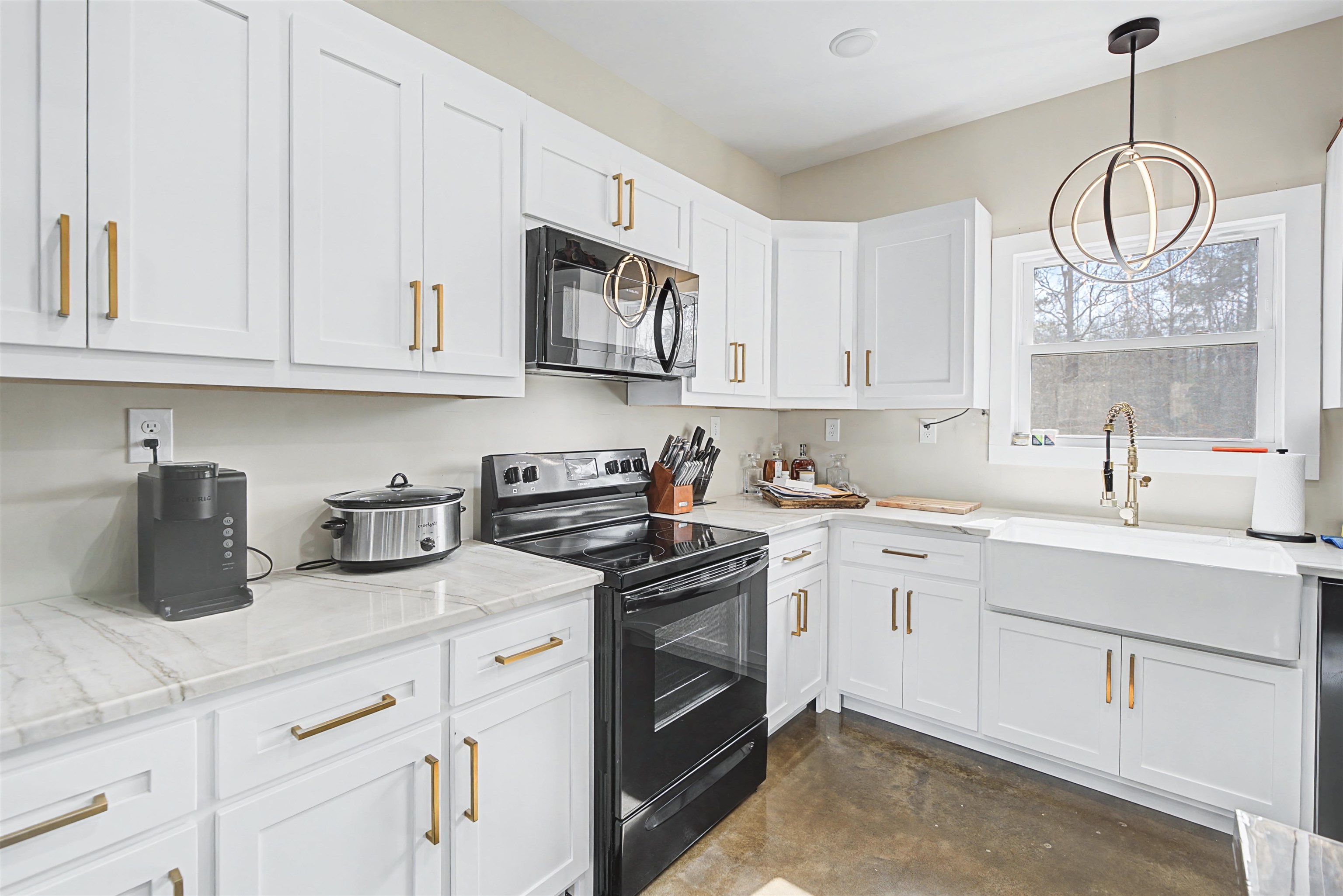 5439 Hines Gin Road Selmer, TN 38375 - Photo 13 of 33 a kitchen with cabinets and window