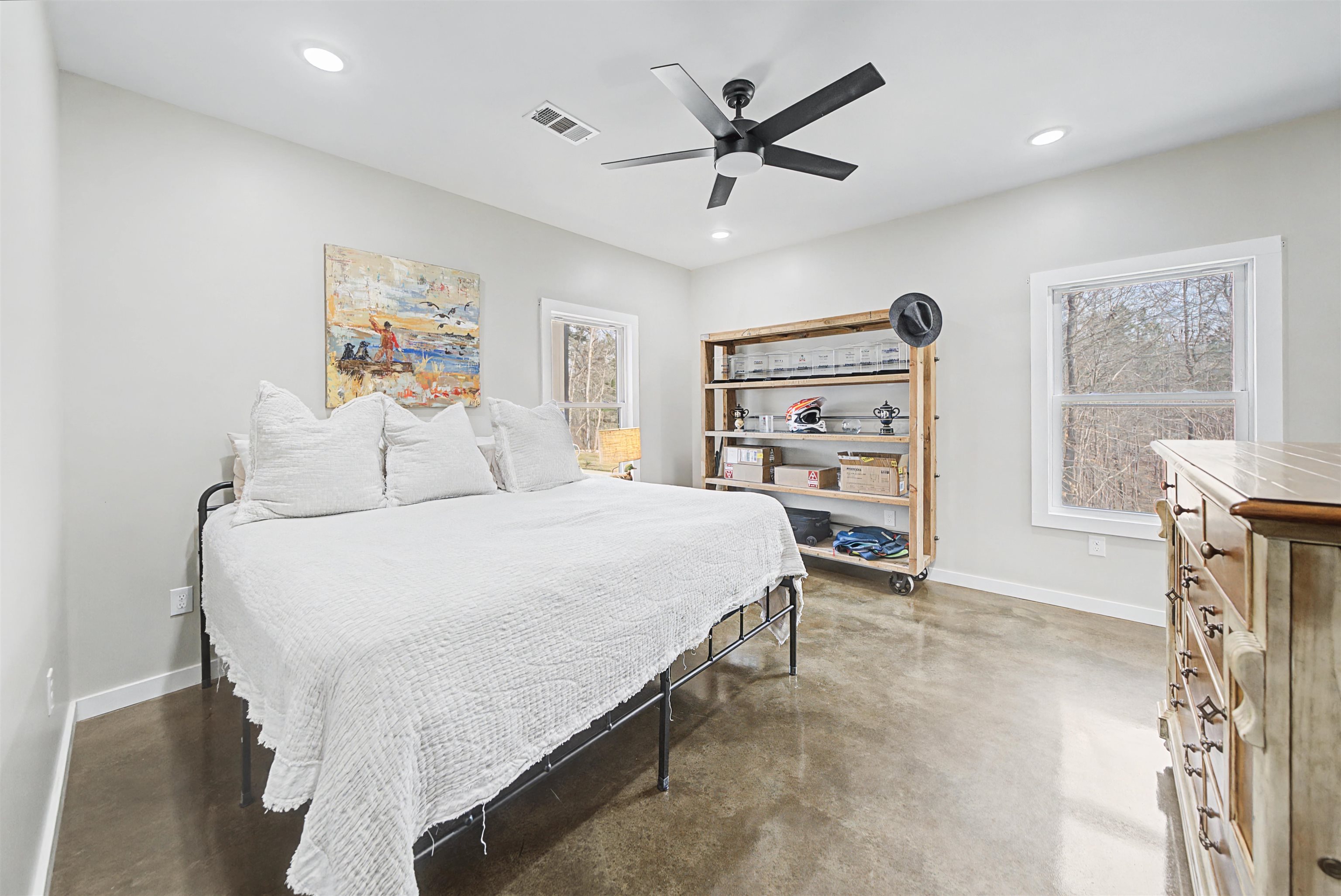 5439 Hines Gin Road Selmer, TN 38375 - Photo 14 of 33 a bedroom with a large bed and a chandelier