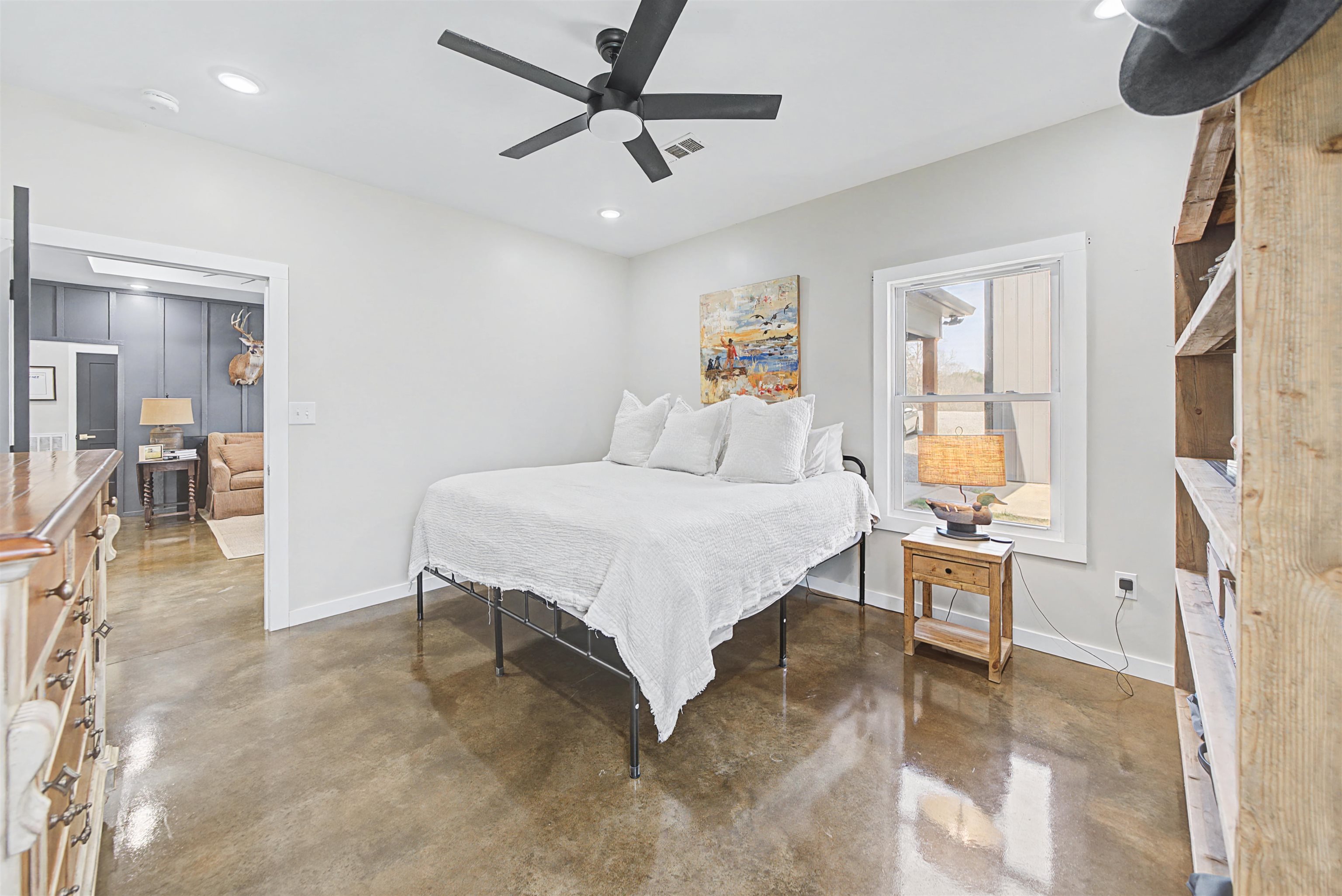 5439 Hines Gin Road Selmer, TN 38375 - Photo 15 of 33 a bedroom with a bed couch and a window