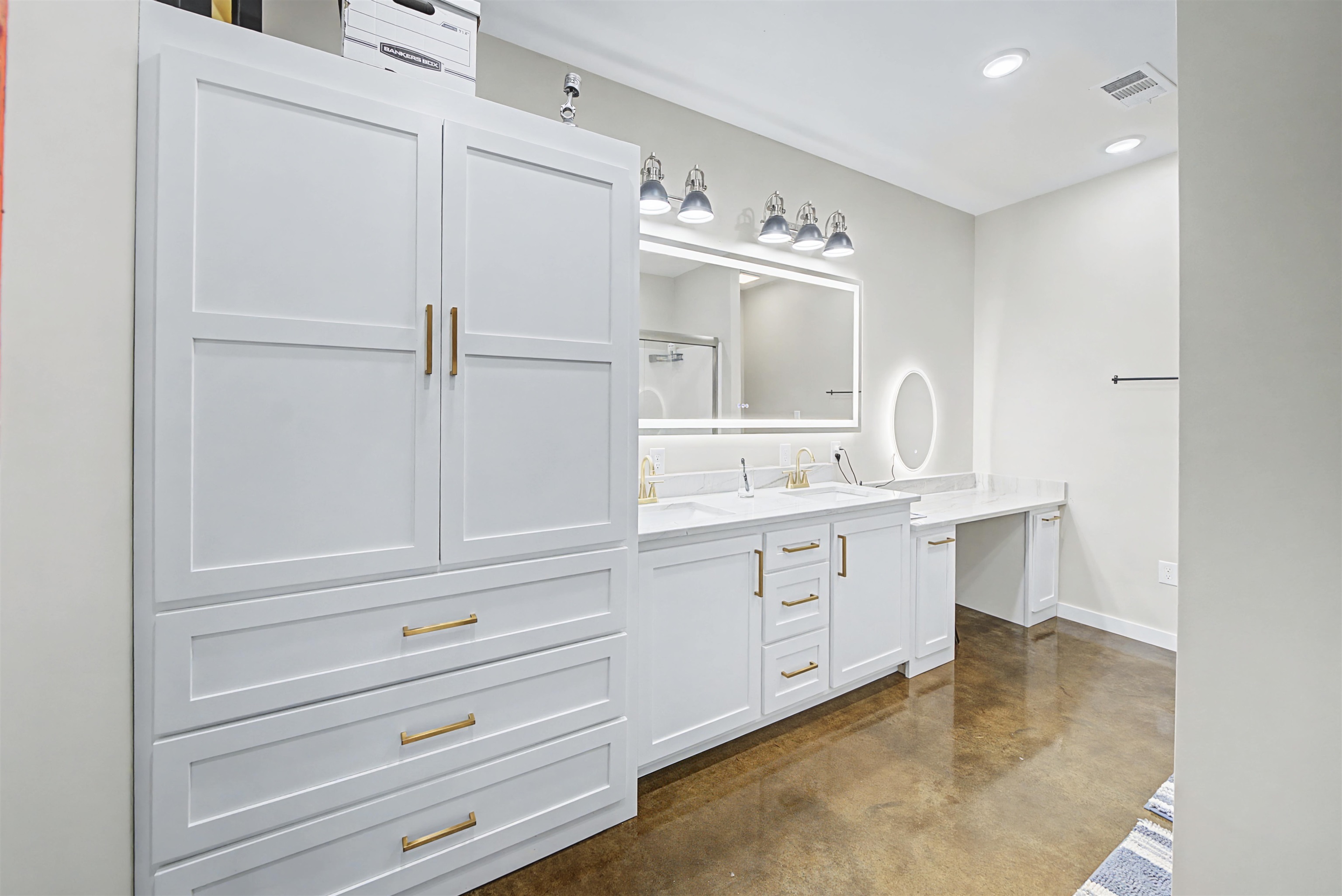 5439 Hines Gin Road Selmer, TN 38375 - Photo 16 of 33 a spacious bathroom with a double vanity sink a mirror and a bathtub