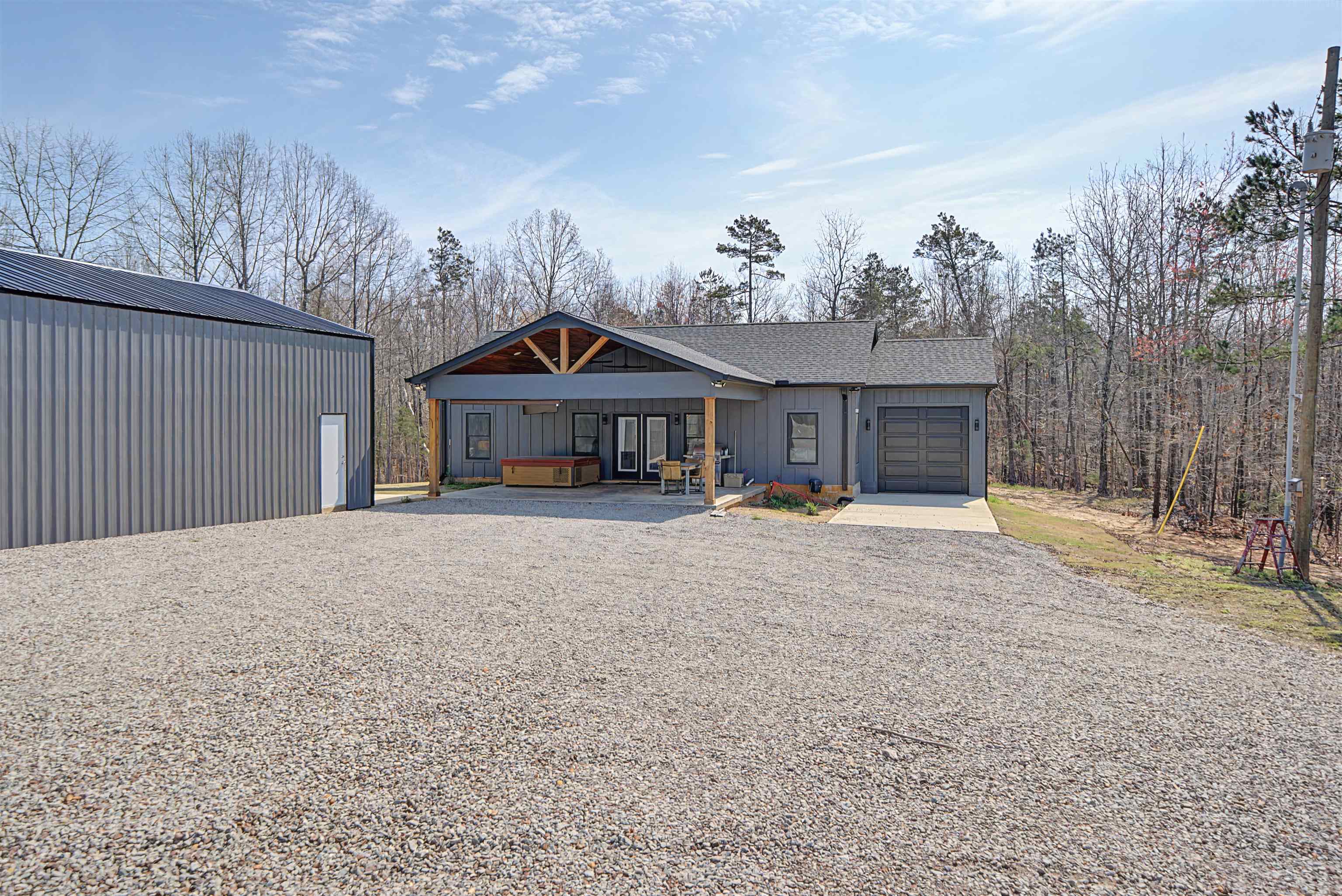5439 Hines Gin Road Selmer, TN 38375 - Photo 2 of 33 a front view of a house with a yard and garage