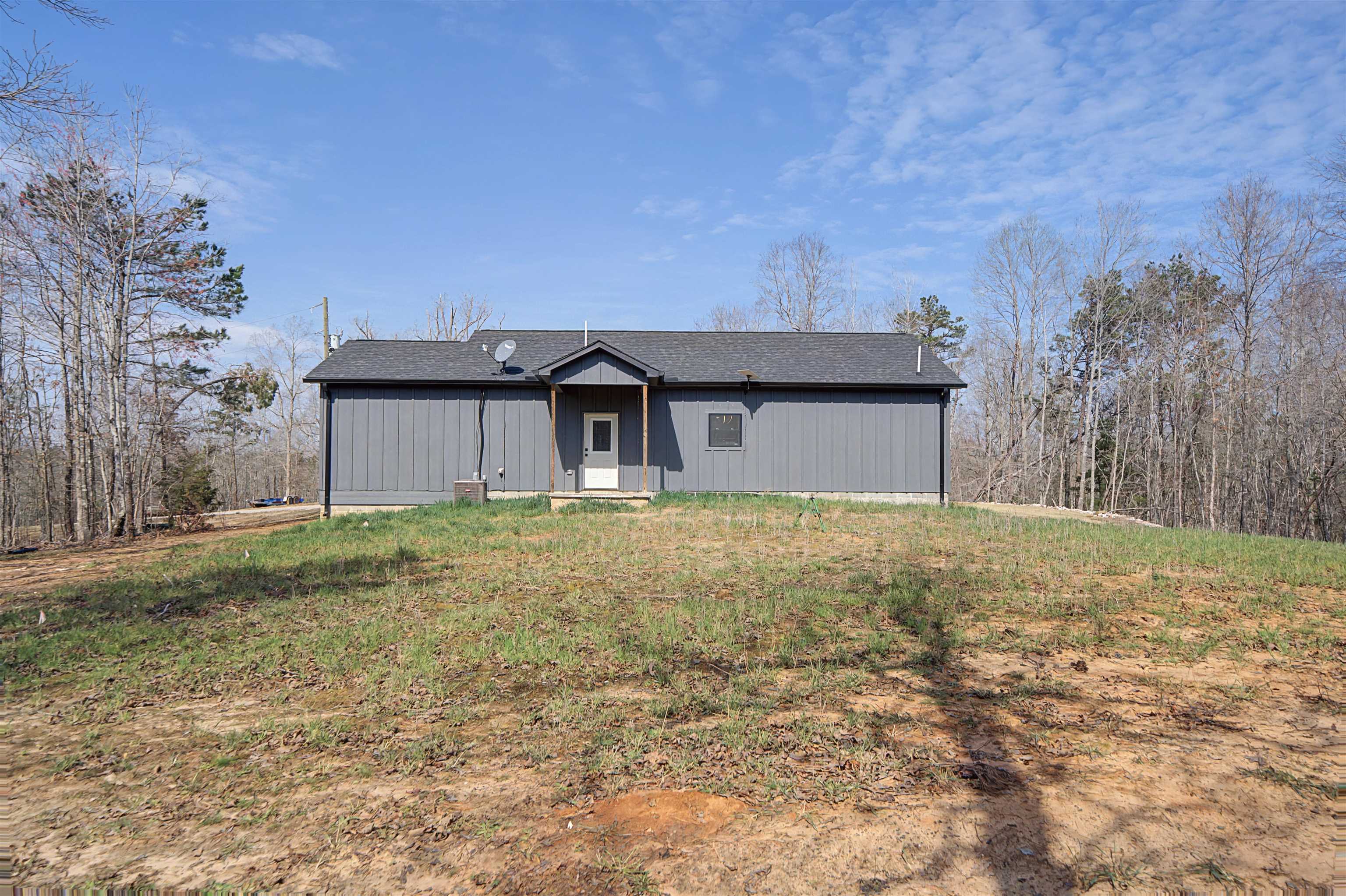 5439 Hines Gin Road Selmer, TN 38375 - Photo 25 of 33 a house with trees in front of it
