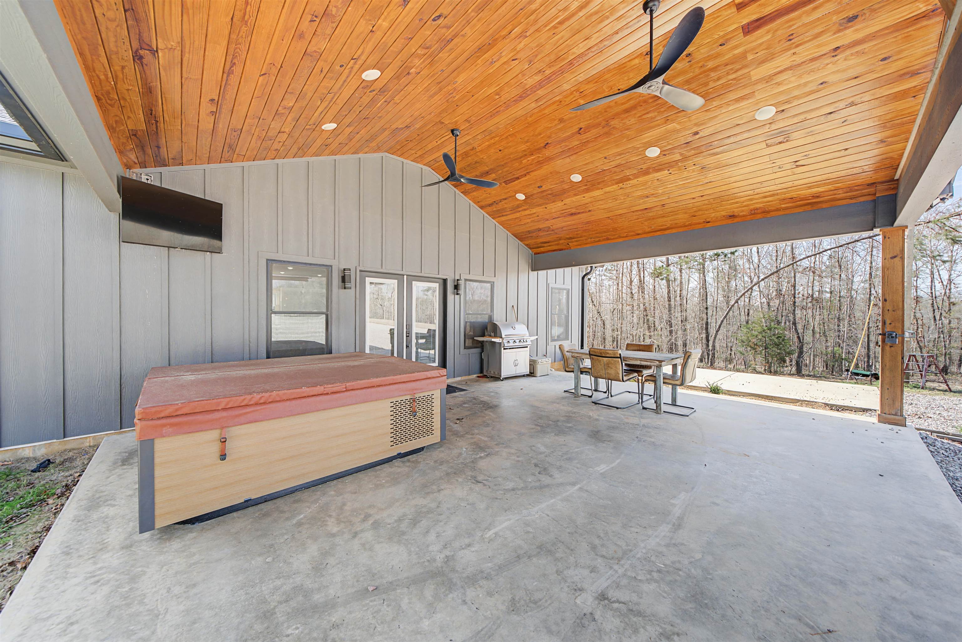 5439 Hines Gin Road Selmer, TN 38375 - Photo 5 of 33 a spacious bedroom with a large bed and a chandelier