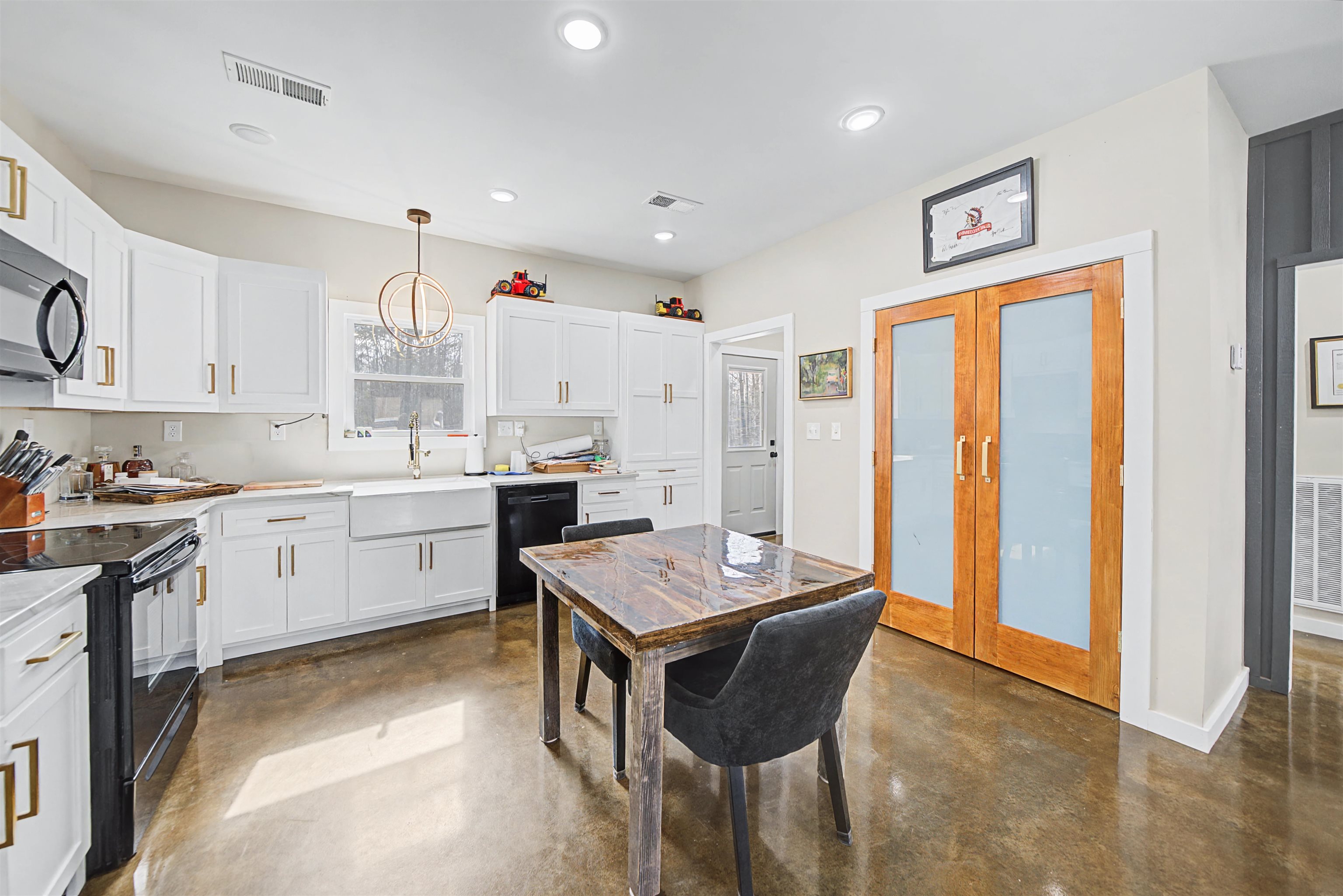 5439 Hines Gin Road Selmer, TN 38375 - Photo 9 of 33 a kitchen that has a lot of cabinets in it and appliances