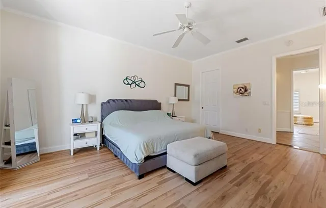 a spacious bedroom with a bed and a couch