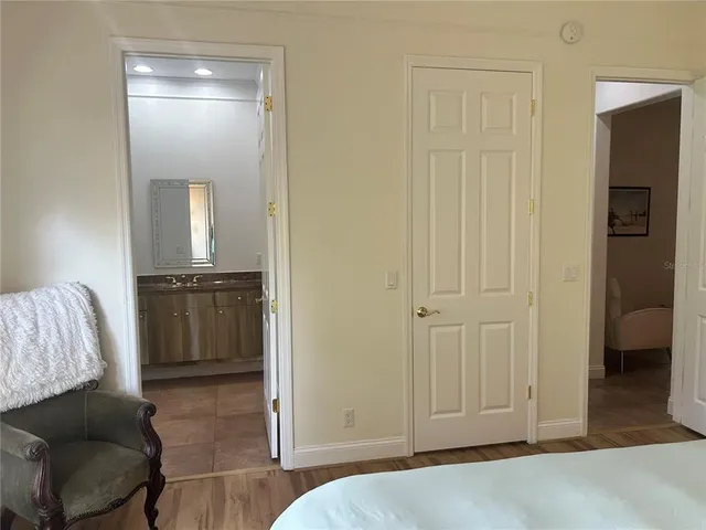 a living room with furniture and a walk in closet