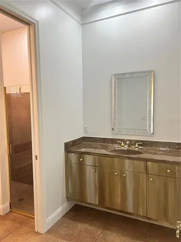 a reading room with wooden floor and furniture