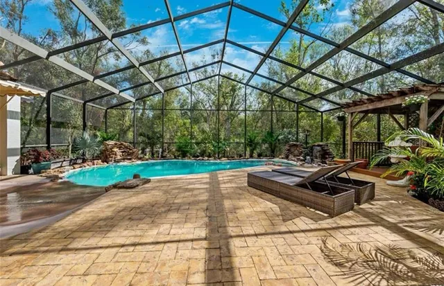 a view of yard with patio