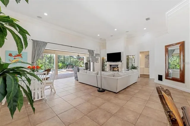 a living room with furniture and flat screen tv