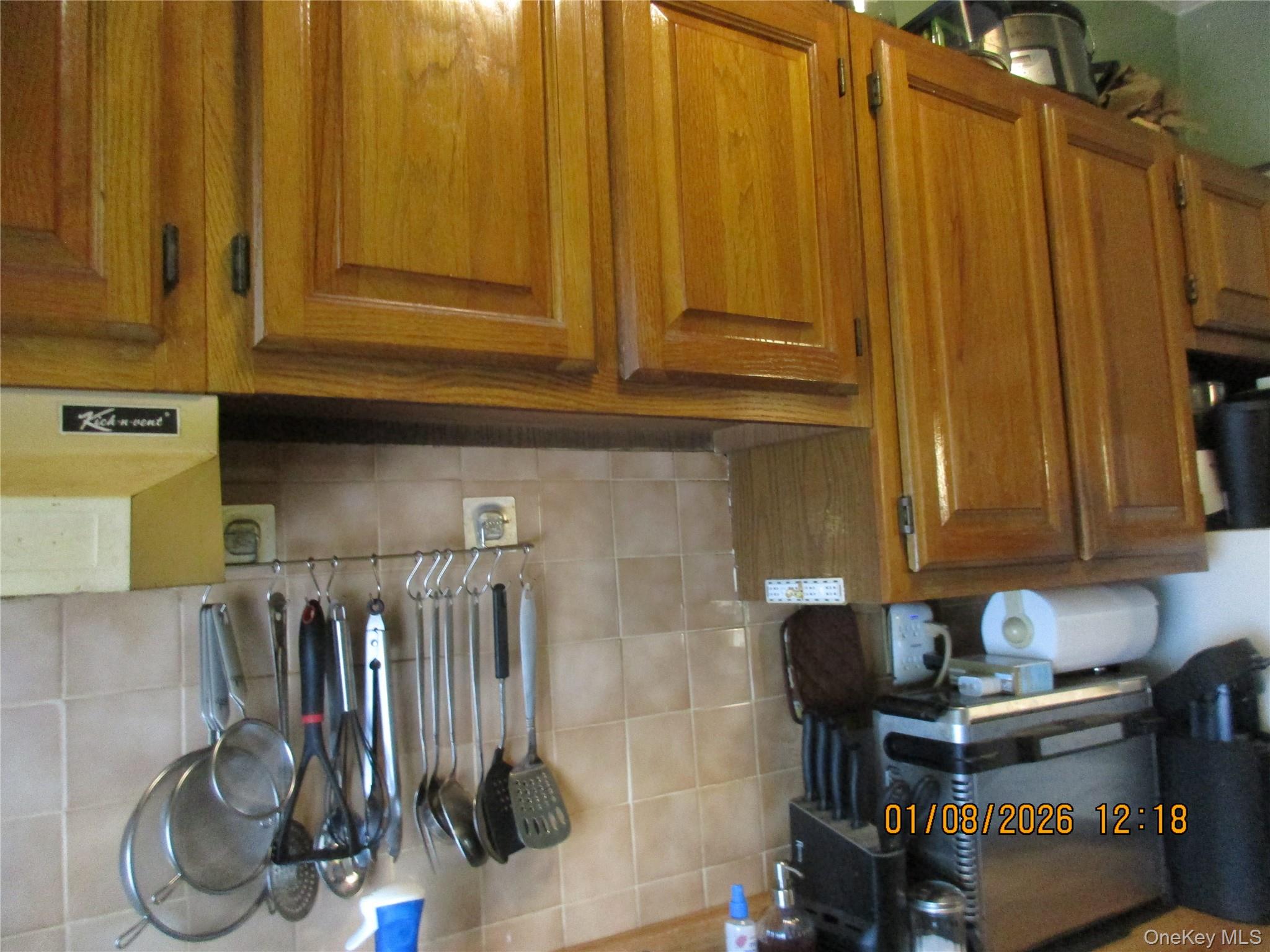 68-09 79th Street Queens, NY 11379 - Photo 11 of 15 a view of a door and chair in the kitchen