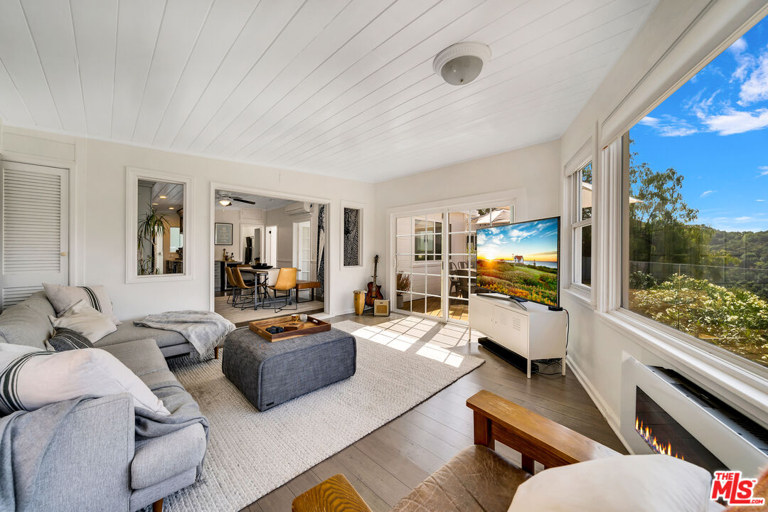 2016 Mt Prospect Drive Topanga, CA 90290 - Photo 18 of 41 a living room with furniture and a flat screen tv