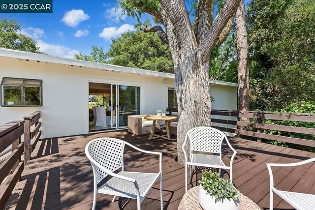 a patio with a yard table and chairs