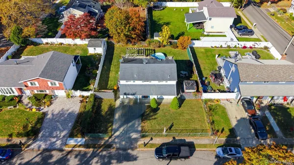 an aerial view of houses with outdoor space
