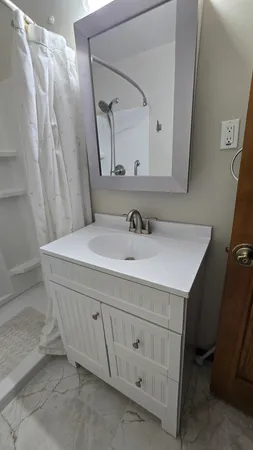a bathroom with a sink and a mirror