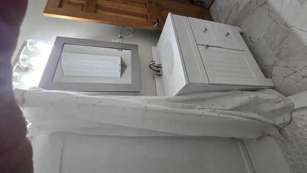 a utility room with a wooden floor washer and dryer