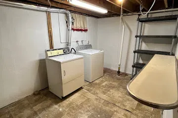 a view of a room with washer and dryer
