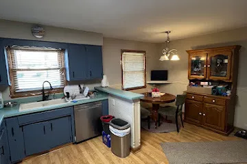 a kitchen with a sink cabinets and window