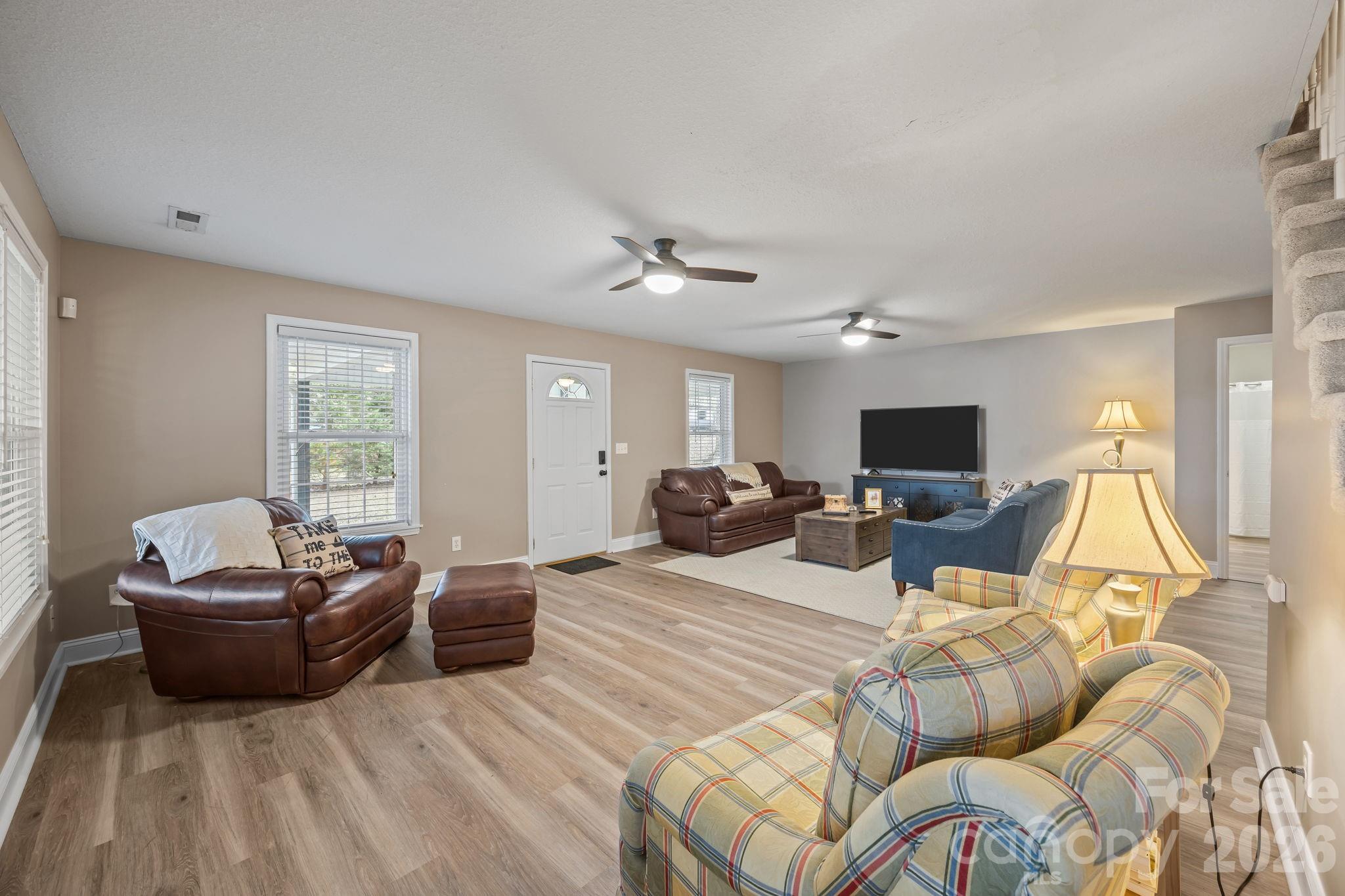 1870 Scout Road Salisbury, NC 28146 - Photo 23 of 48 a living room with furniture a flat screen tv and a large window