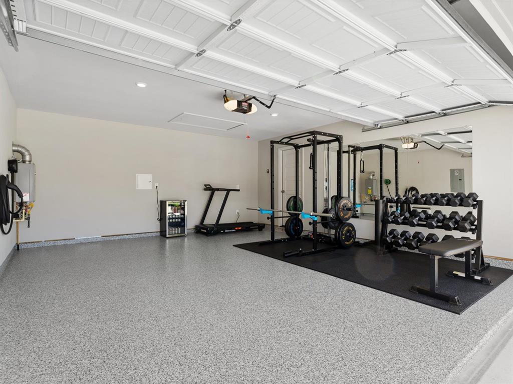 166 Palo Duro Bend Rhome, TX 76078 - Photo 38 of 40 Upgraded garage with epoxy flooring. Ideal for a home gym