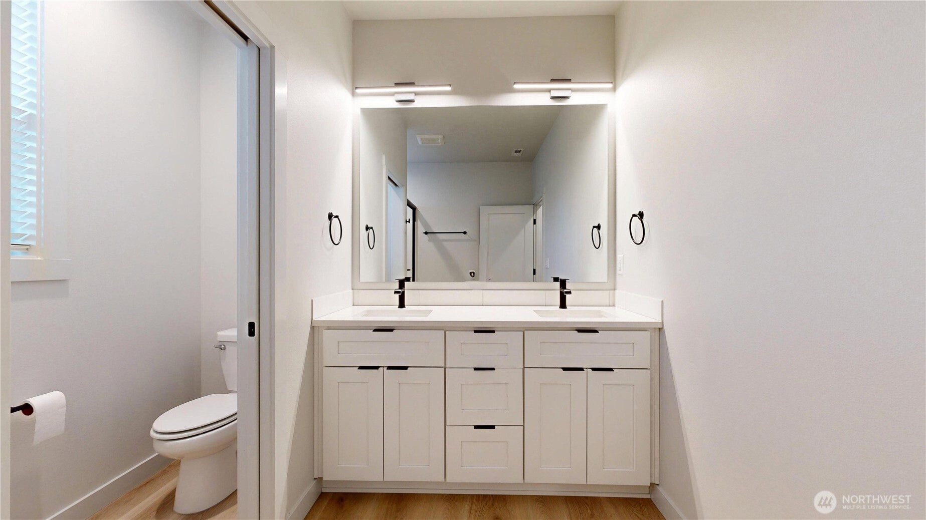 916 Hidden Lane Prosser, WA 99350 - Photo 17 of 24 a bathroom with a toilet a sink and mirror